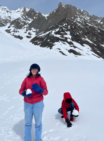 Kids in cozy puffer jackets and gloves enjoy playing in the snow, staying warm so parents can relax too.