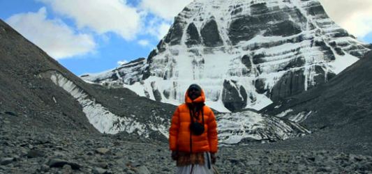 Snow-capped peaks at Kailash Mansarovar standing tall beneath a vast, clear sky.