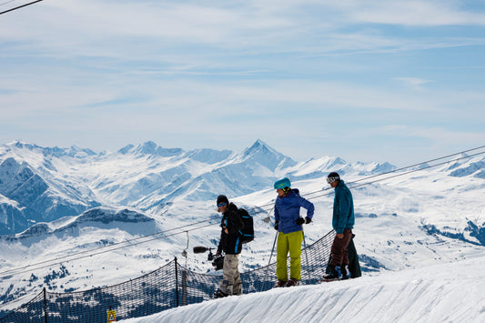 Photo by Esther Höfling of three adventure seekers skiing the swiss alps