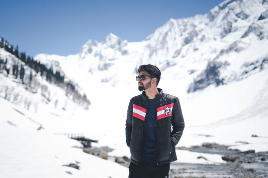 Photo by Iqbal farooz of a man in mountains in winter