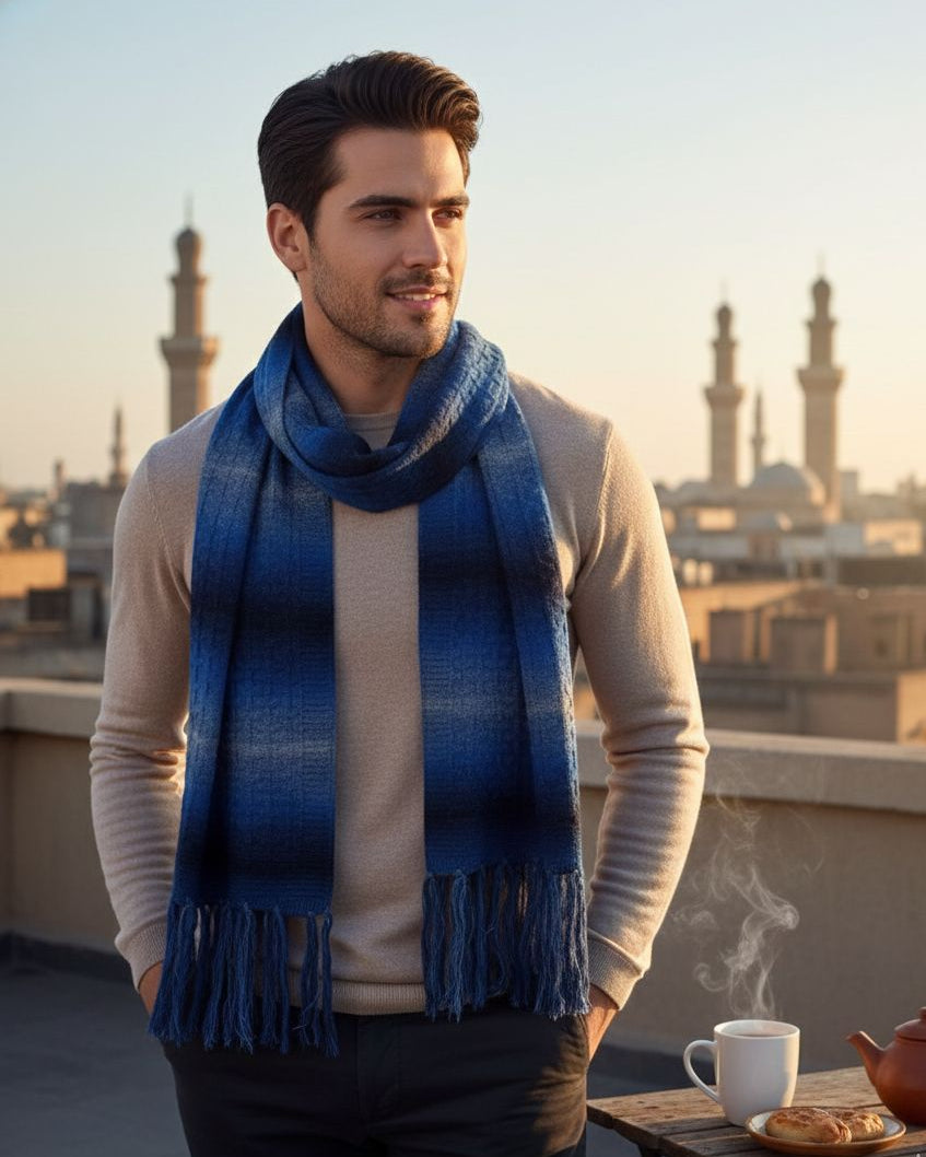 Man wearing a blue scarf with a cityscape in the background