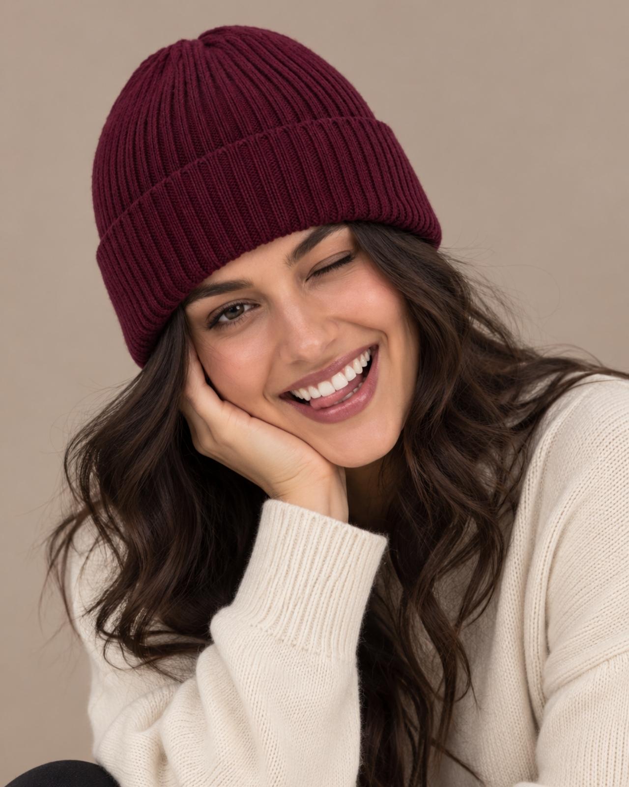 Woman wearing a maroon Ribbed Merino Wool Cap
